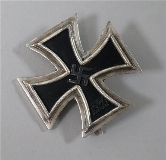 A World War II Iron Cross 1st class pin, marked 65